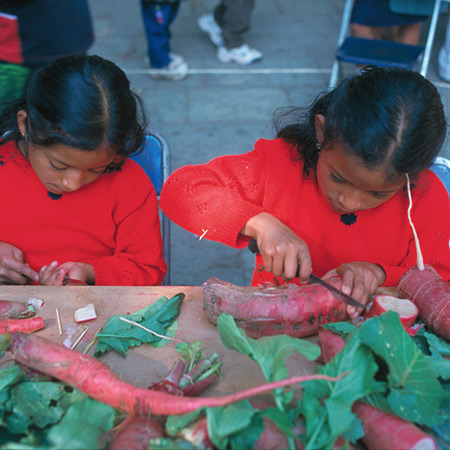 Girls in the radish-carving competition at the Noche de los Rabanos festival, Oaxaca, Mexico,