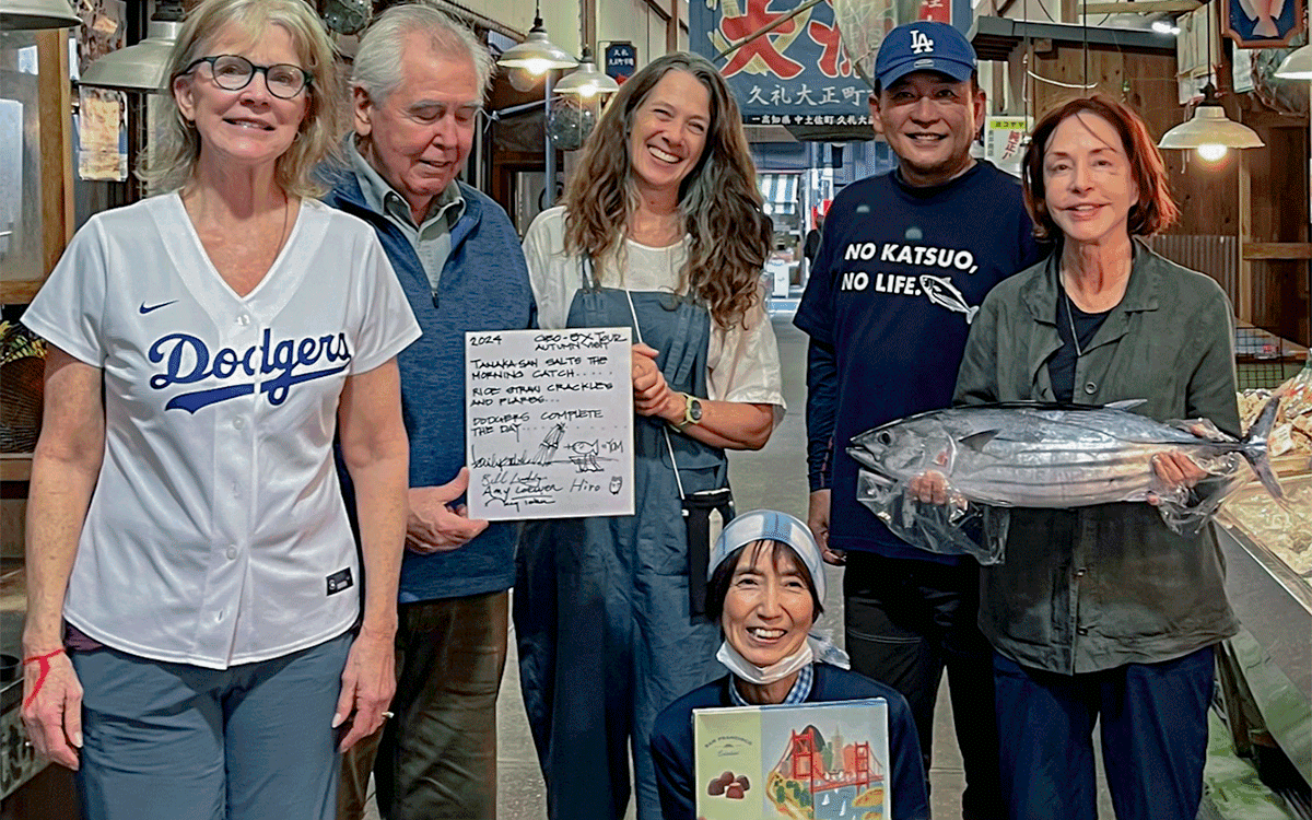 Amy Loewen and GeoEx travelers with locals in Japan