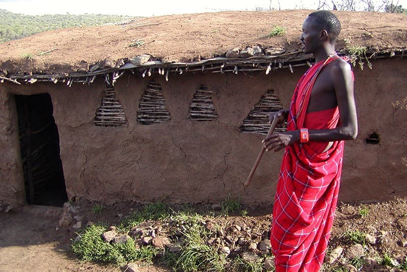 kenya masai man thatched roof hut