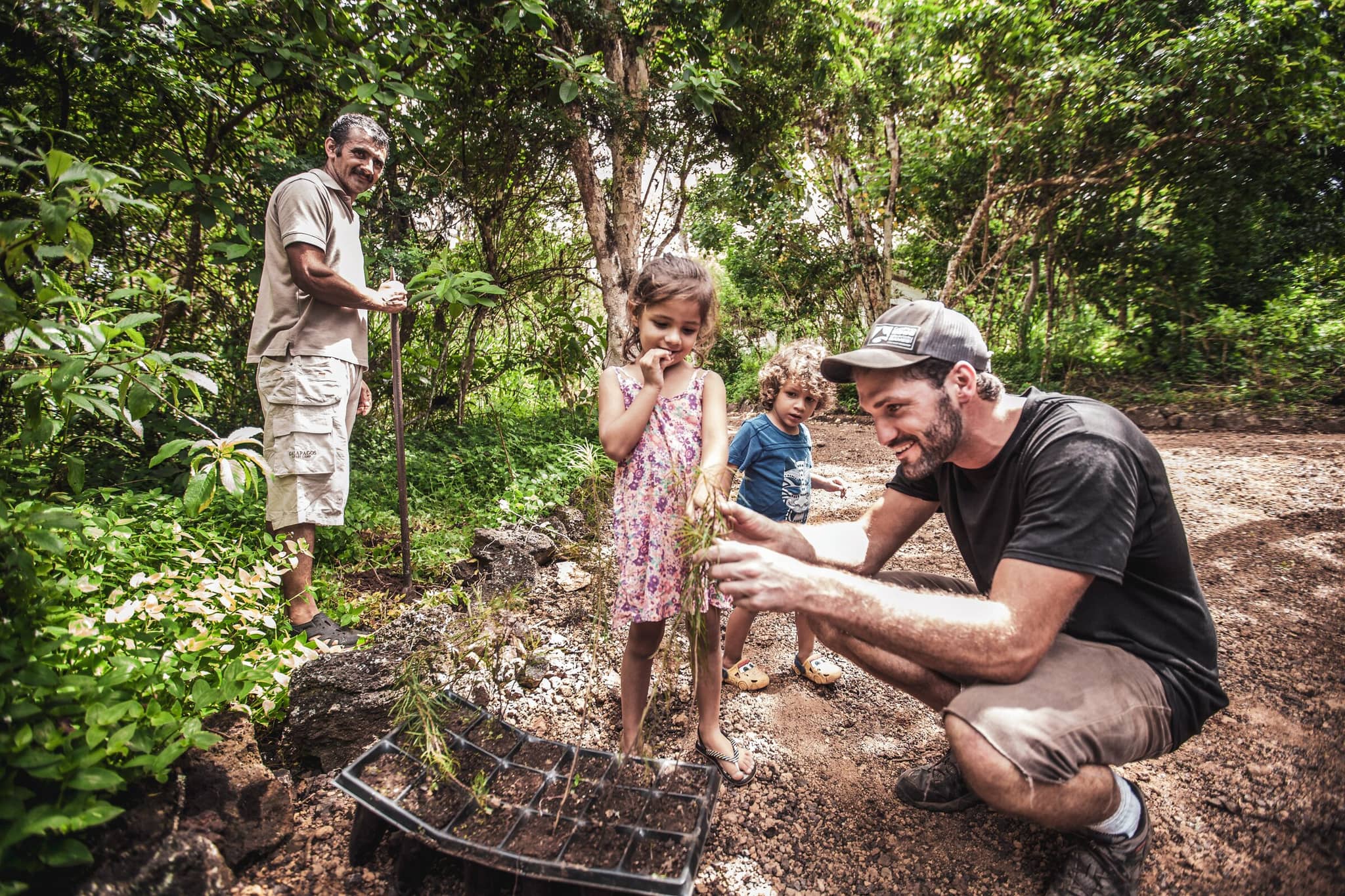 a family with a child and with a tour guide in a jungle