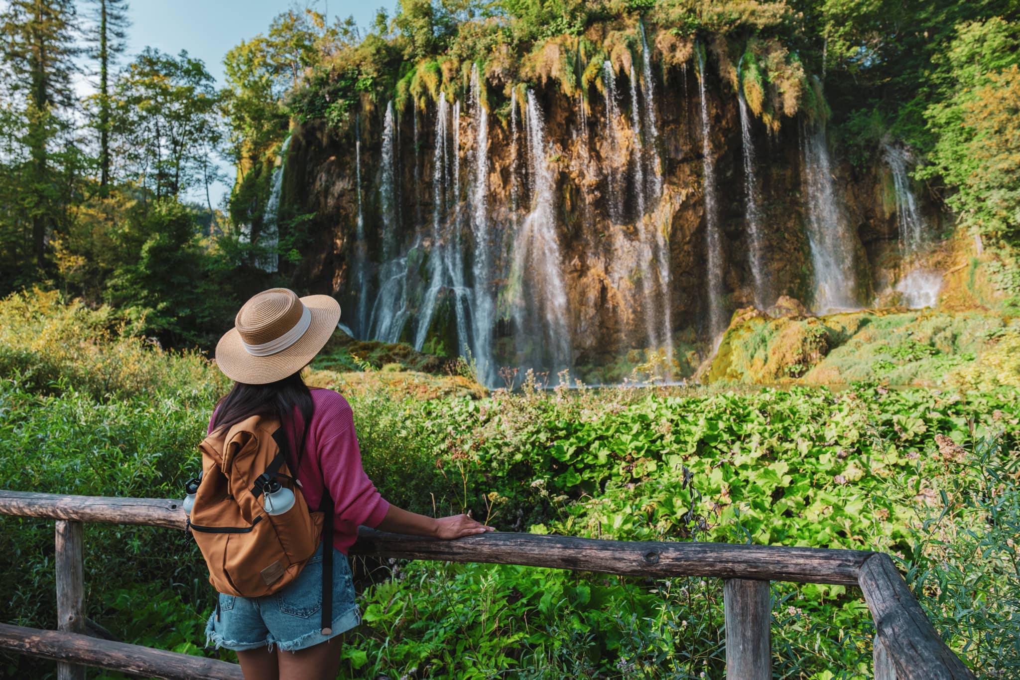 Woman walking through Plitvice Lakes National Park, Croatia