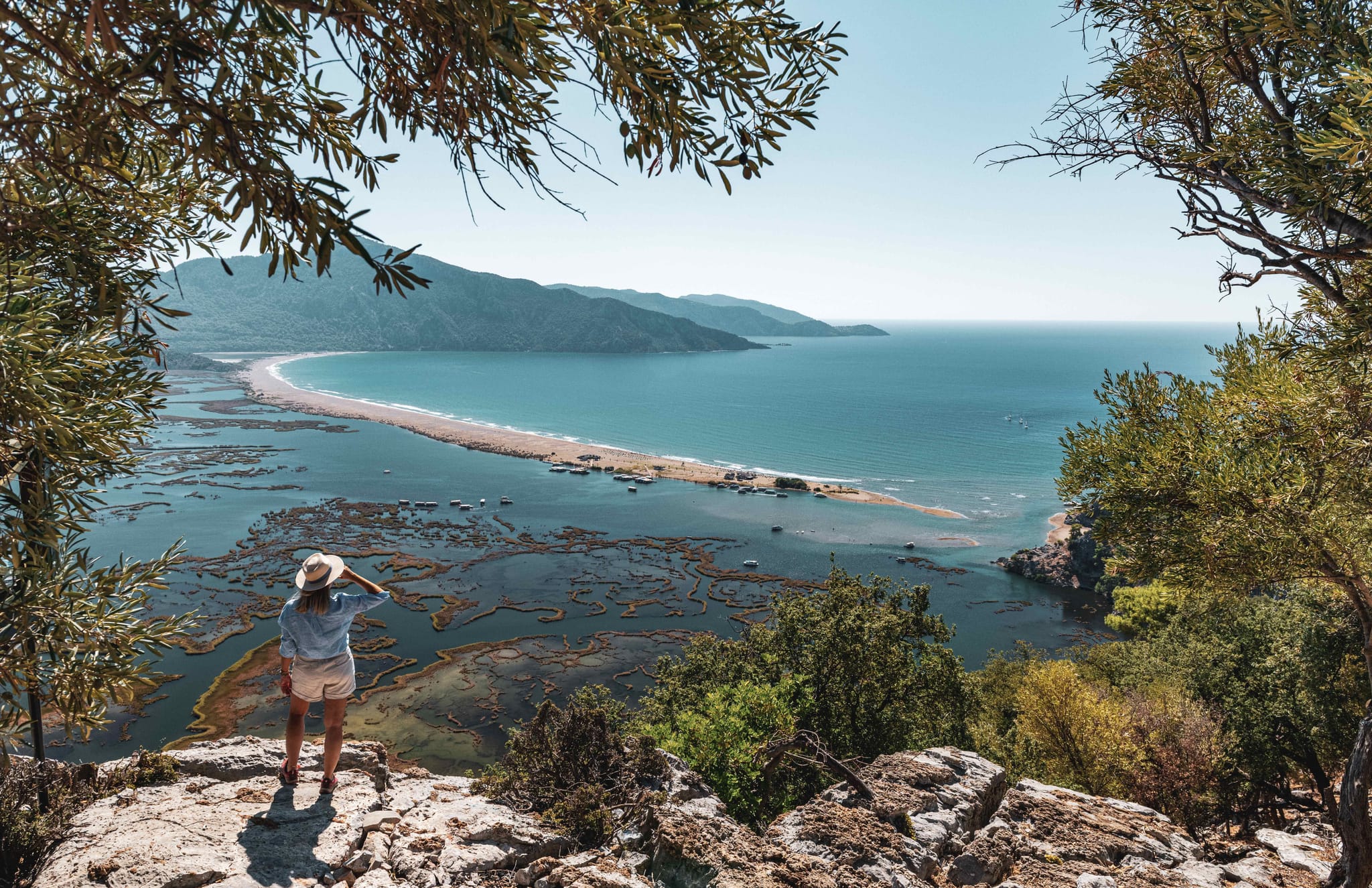 Woman standing on Iztuzu Beach, Dalyan in Turkiye.