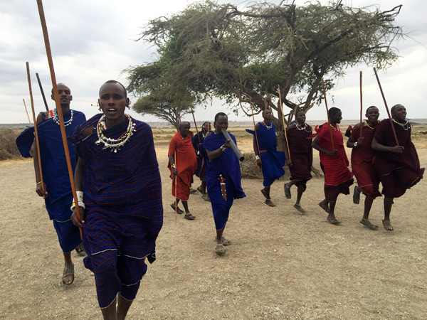 Maasai warriors dancing in Africa with GeoEx.