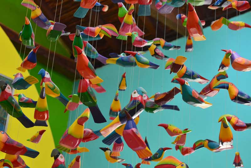 Local art with colorful paper birds in Nicaragua with GeoEx.
