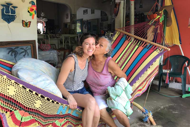 Natalie Crowe and local woman share a hug in Nicaragua with GeoEx.