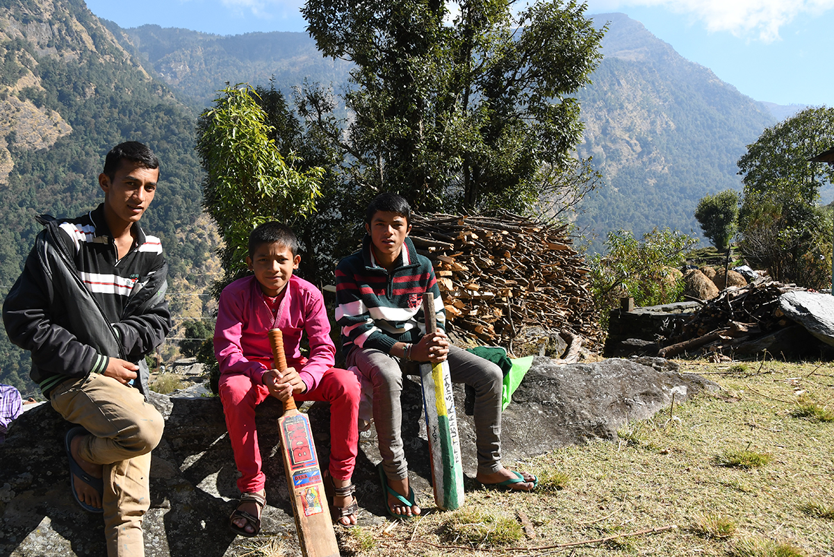 Boys playing cricket in a remote village in Kumaon in India