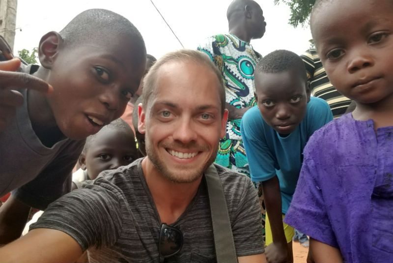GeoEx Travel Expert Jesse Knight, with kids in Benin