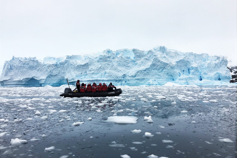 Looking at iceberg from a Zodiac curing Antarctica cruise