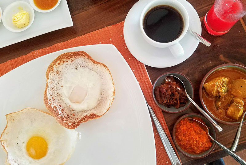 A breakfast of egg hoppers and coffee in Sri Lanka