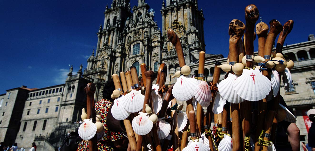 Stall selling symbols of Camino scallop shells and staffs in front of Santiago Cathedral, Spain