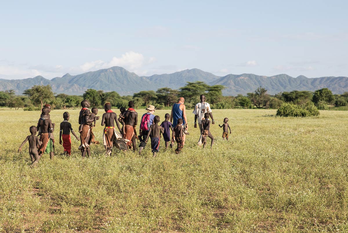 GeoEx travelers meeting the Kara tribe, Omo Valley, Ethiopia