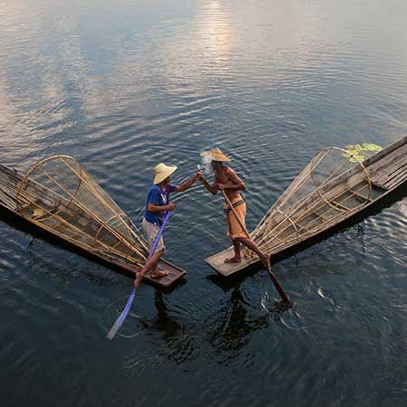Two leg rowers meet on Myanmar's Inle Lake