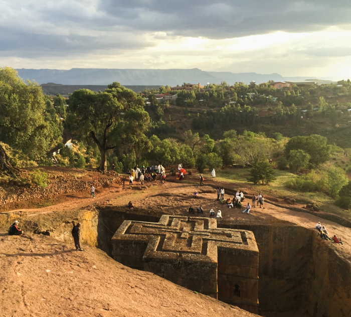 Watching the sunset over a rock carved church in Lalibela, Ethiopia with GeoEx.