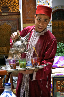 Moroccan serving tea in Fes, Morocco with GeoEx