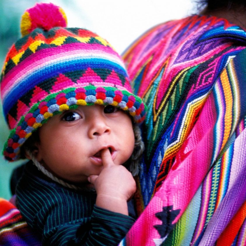 Mother and child in the colorful market town of Chichicastenango, Guatemala