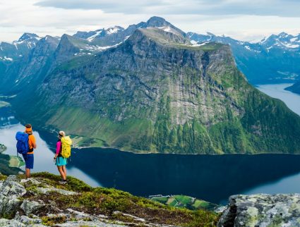 Two hikers overlooking peaks and fjords on the Saksa hike, Norway