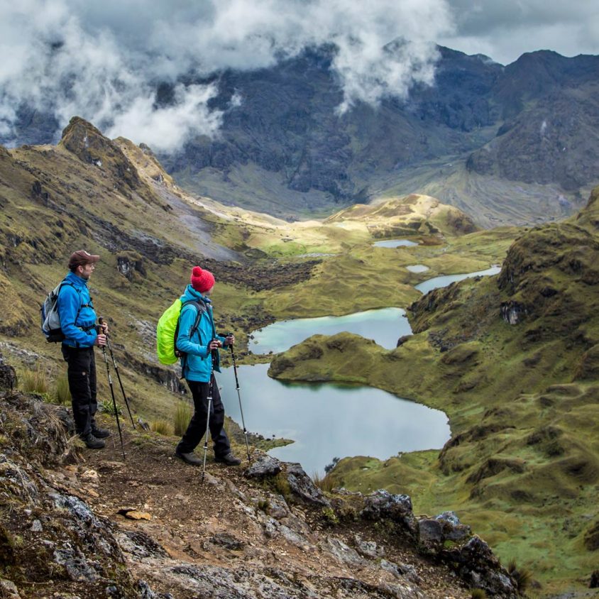 Hikers above a lake in the Lares Valley, Peru