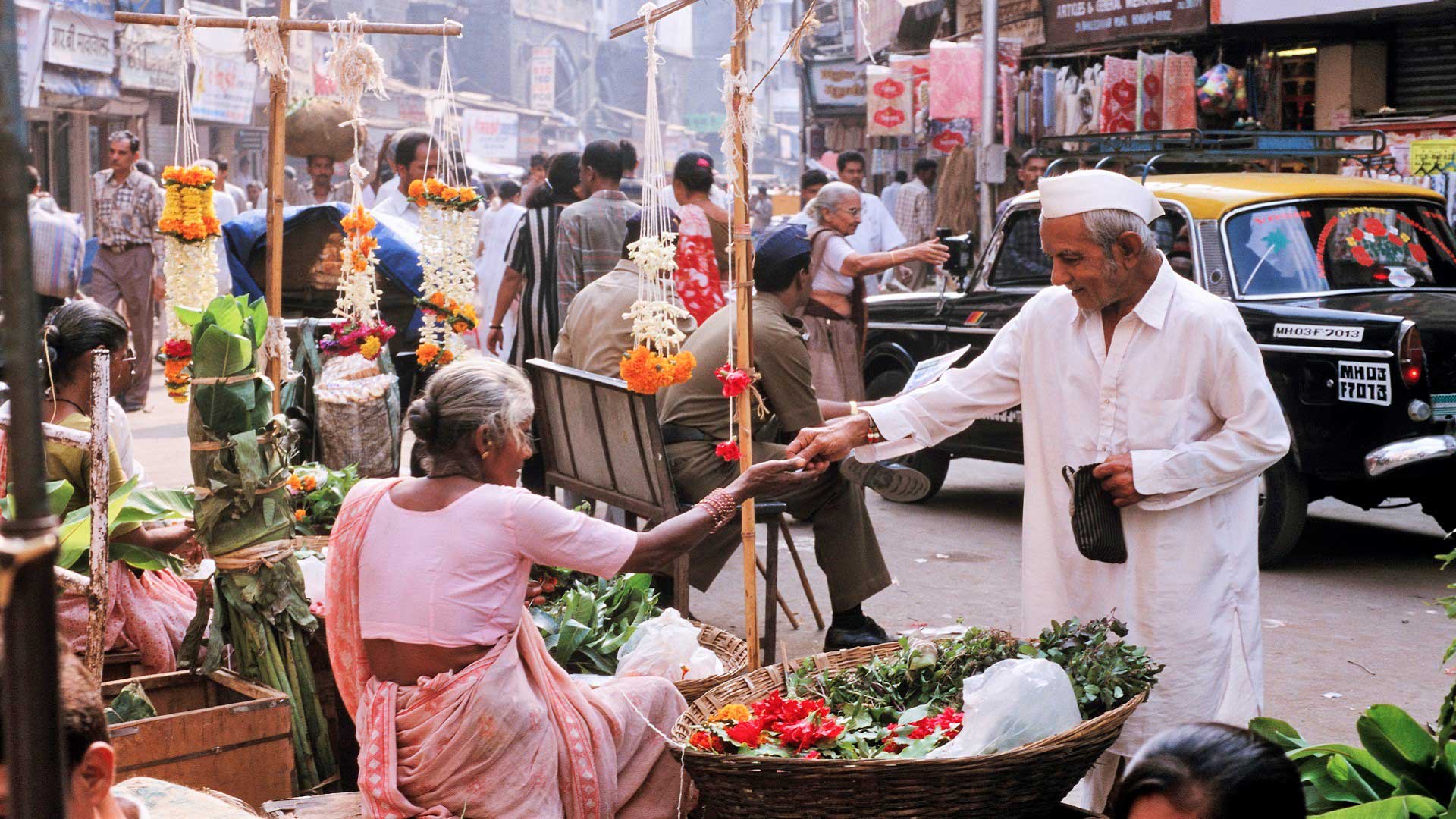 Flower stalls and shoppers in a Mumbai market, India with GeoEx