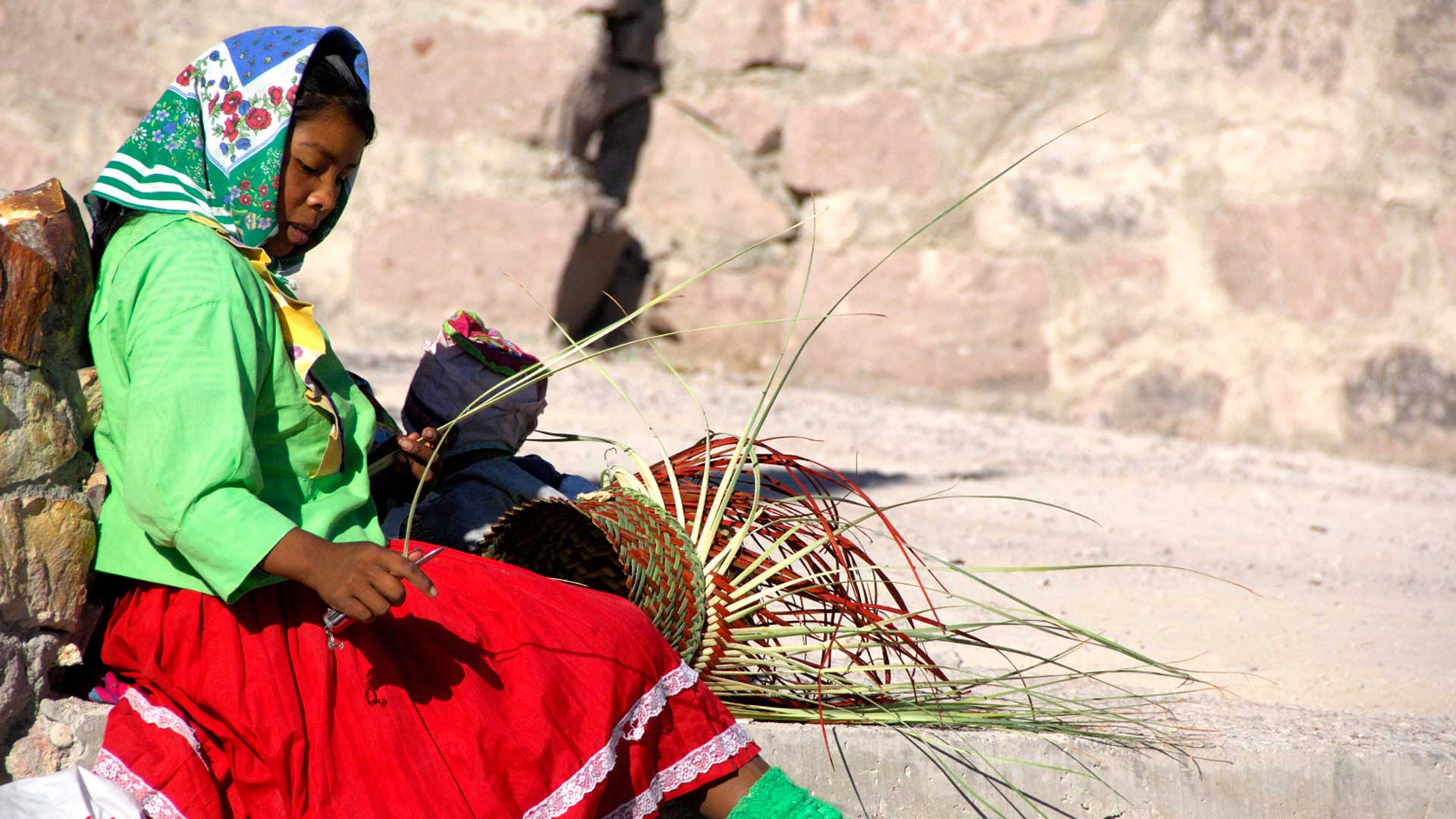 Tarahumara Indian in typical attire making baskets, Chihuahua, Mexico