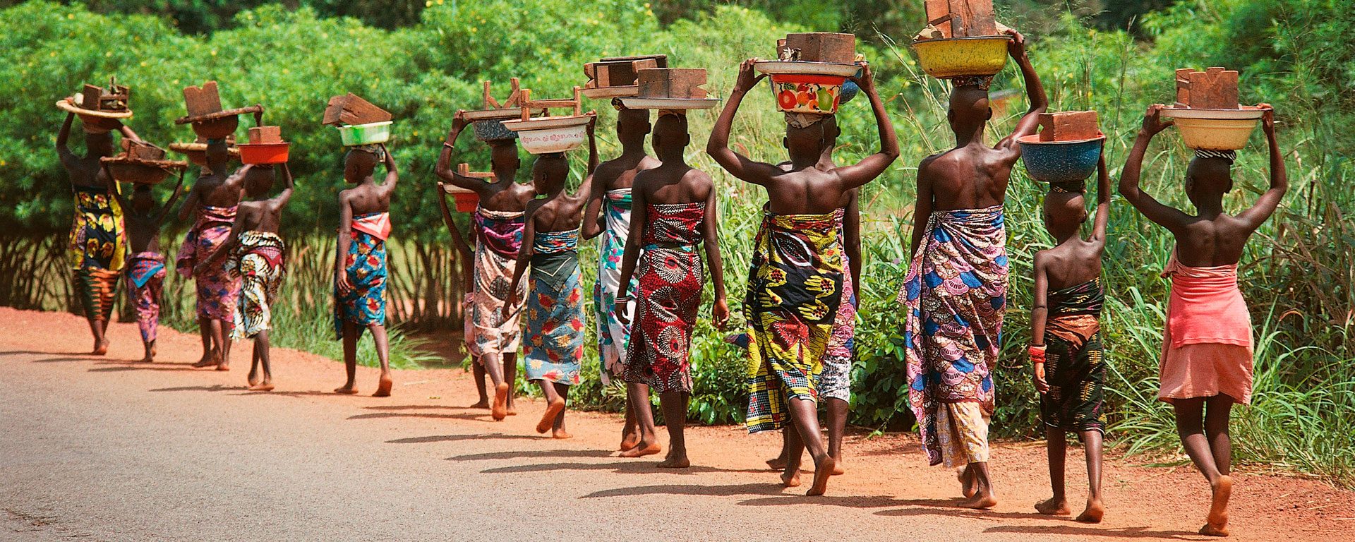 Women walking along road near Cotonou, Benin