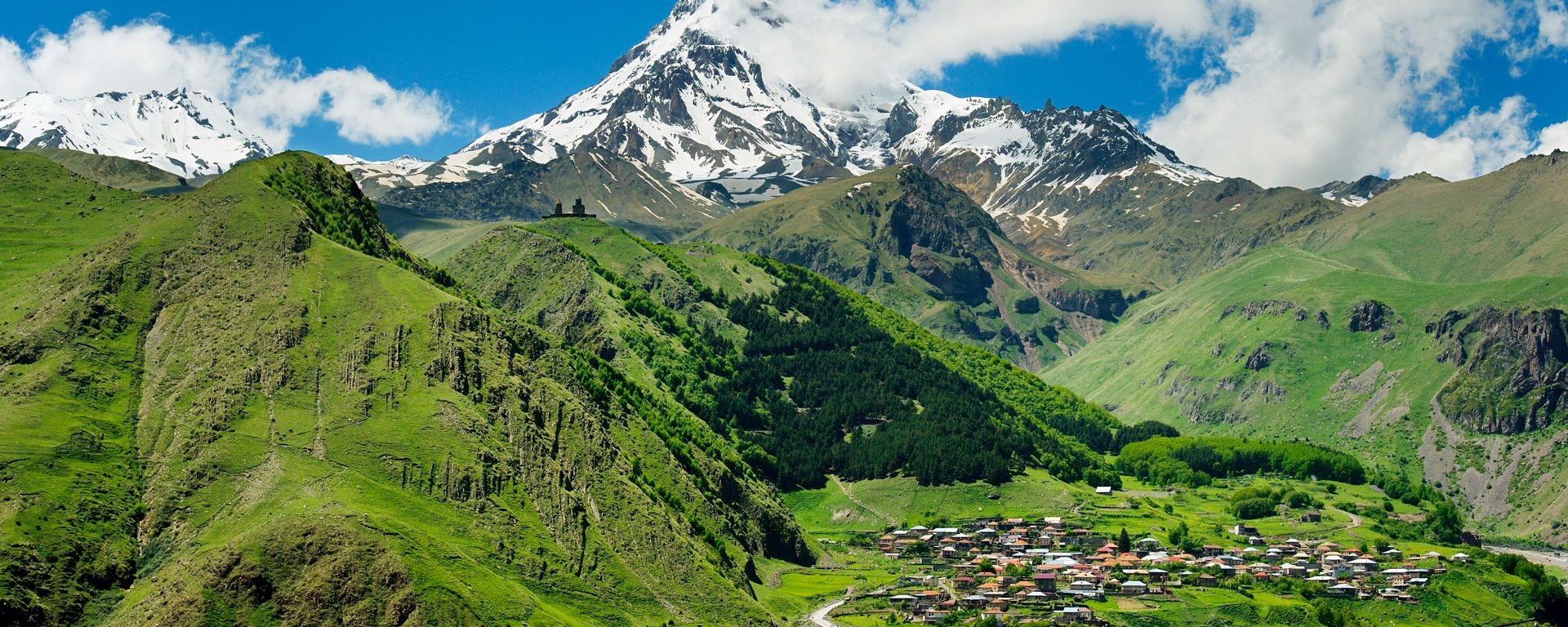 Mount Kazbek and the village of Stepantsminda in Georgia, Caucasus