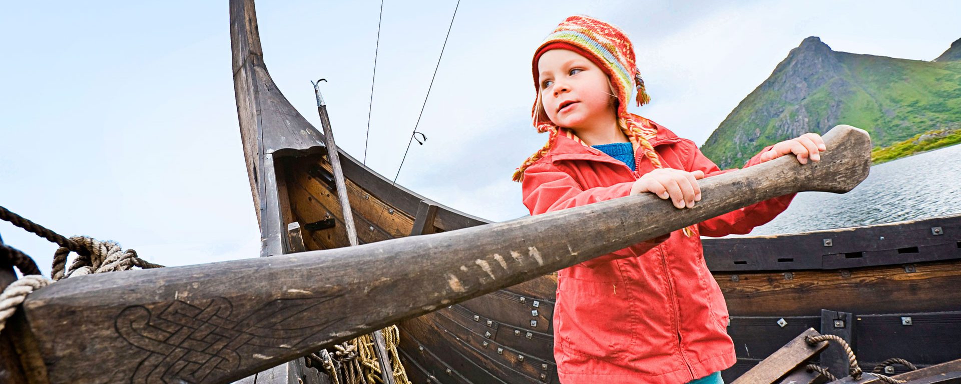 Girl at the oar of a vikingship, Viking museum, Borg, Lofoten, Norway