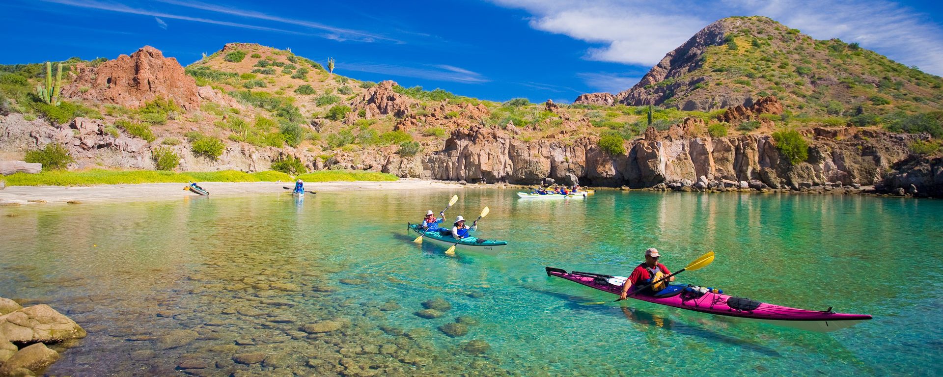 Sea Kayakers in crystalline waters, Honeymoon Cove, Baja, Mexico