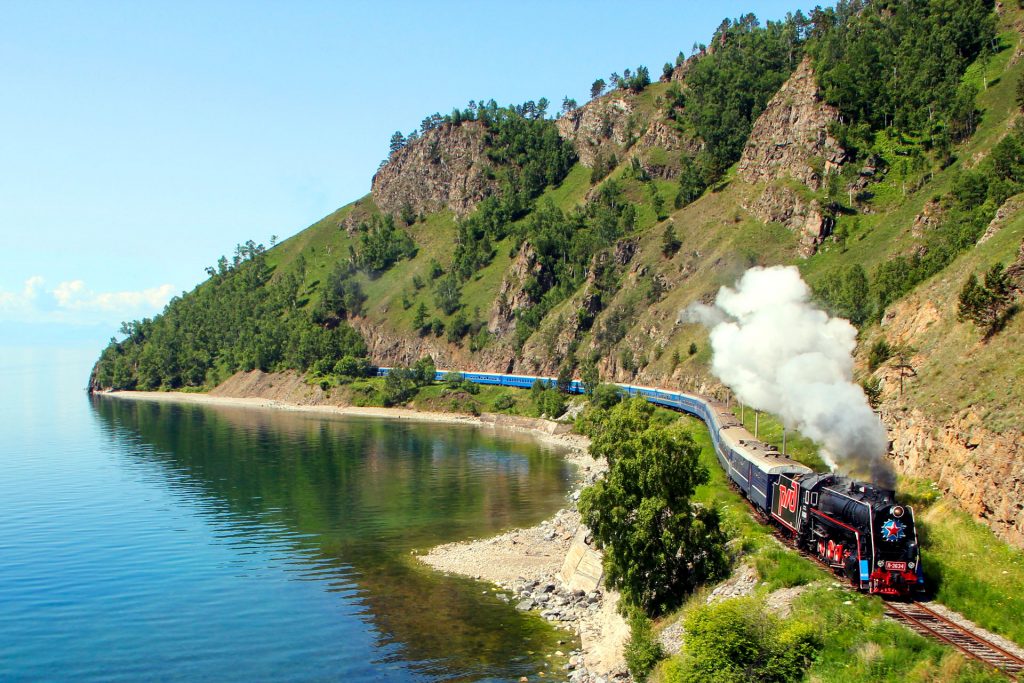 Trans-Siberian train traveling along Lake Baikal in Russia.