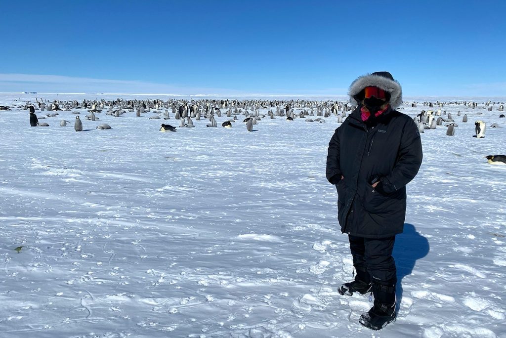 Kate Doty with thousands of penguins.