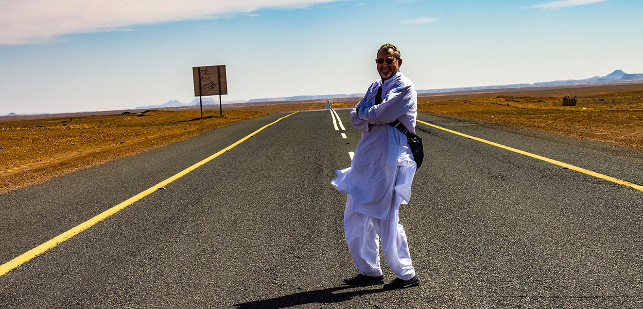 GeoEx trip leader Bill Jones on a road in Saudi Arabia