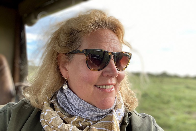 GeoEx trip designer Kate Doty happily on safari in Kenya