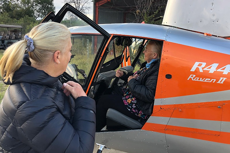 The Bert family traveling by helicopter in Botswana