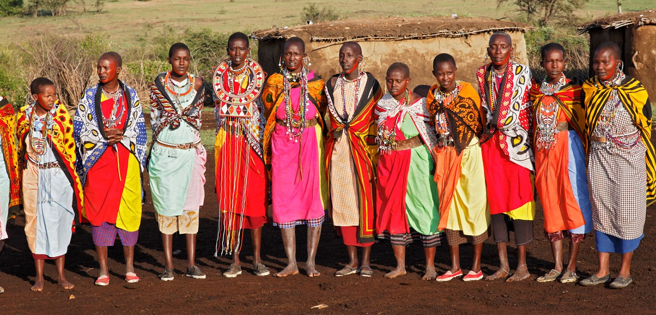 Colorfully dressed Maasai women in village, Kenya