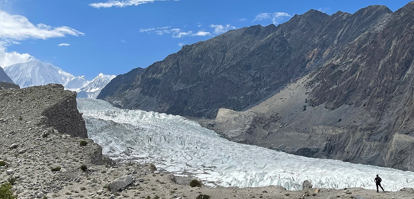 GeoEx CEO Brady Binstadt stands in front of a glacier in Hunza, Pakistan