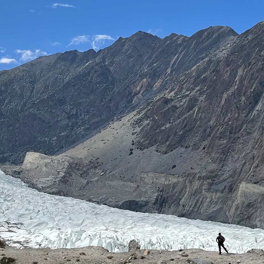 GeoEx CEO Brady Binstadt stands in front of a glacier in Hunza, Pakistan