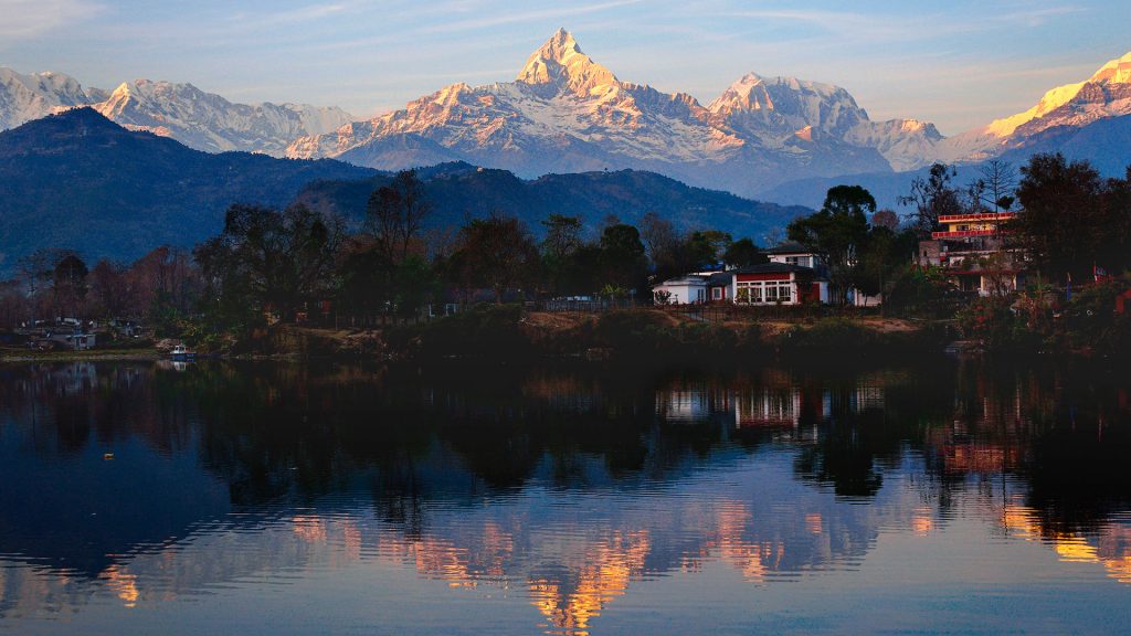 Annapurna range reflected in Phewa Lake in Pokhara, Nepal