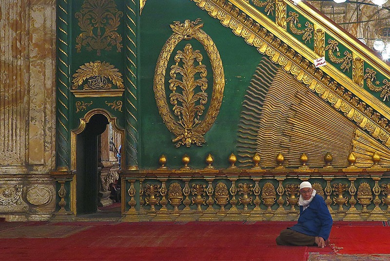 man sitting in mosque, Cairo, Egypt