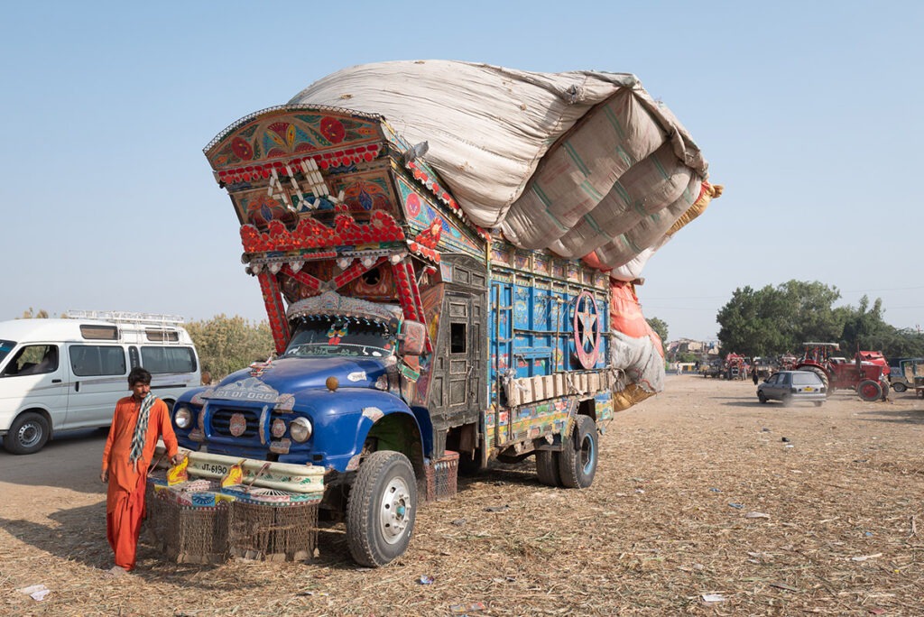 Drive poses with his colorful jingle truck in Pakistan