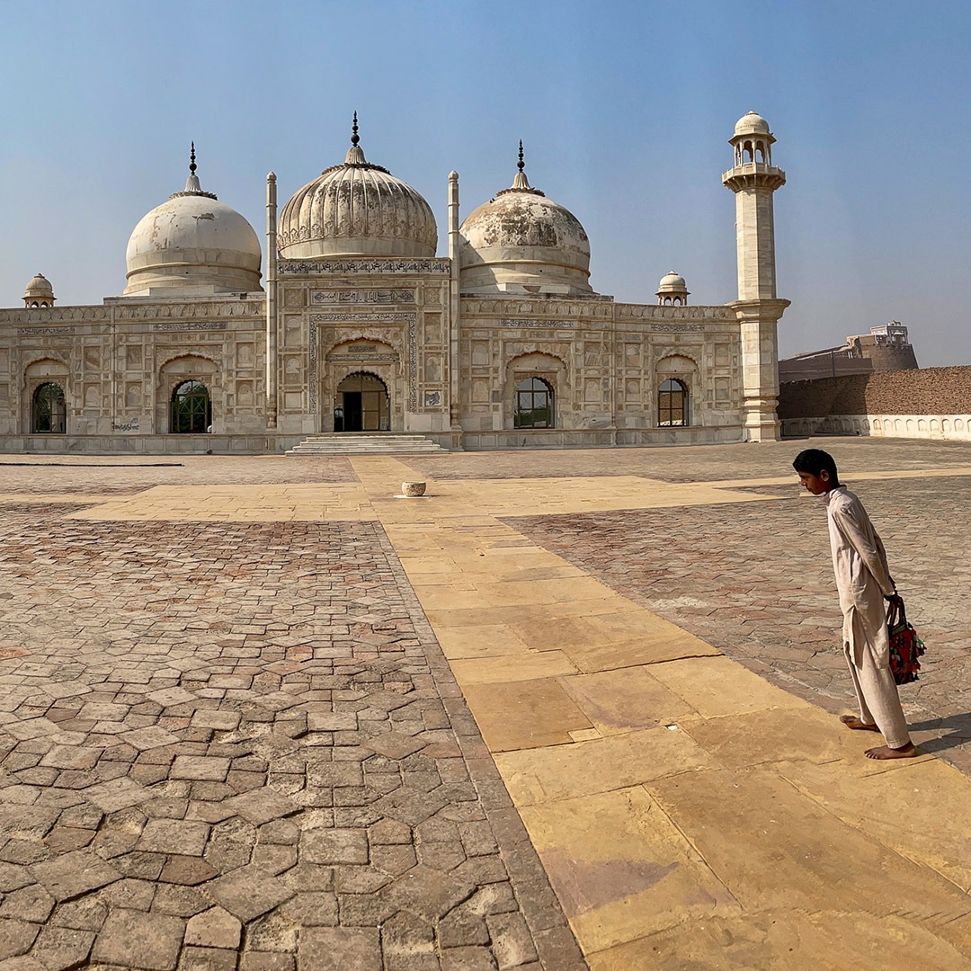 Boys in the courtyard of Abbasi Mosque in Pakistan