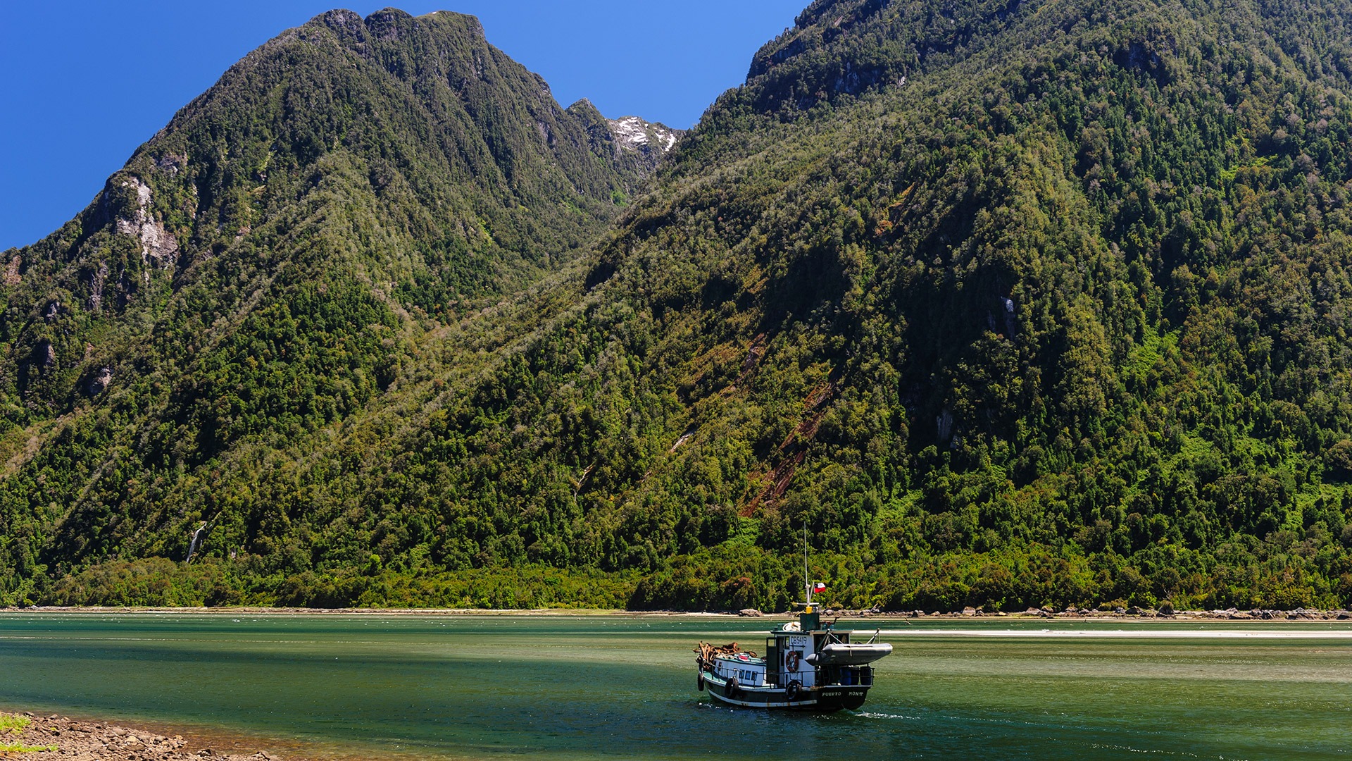 Boat near Cahuelmo Hot Springs in Pumalin National Park, Chile