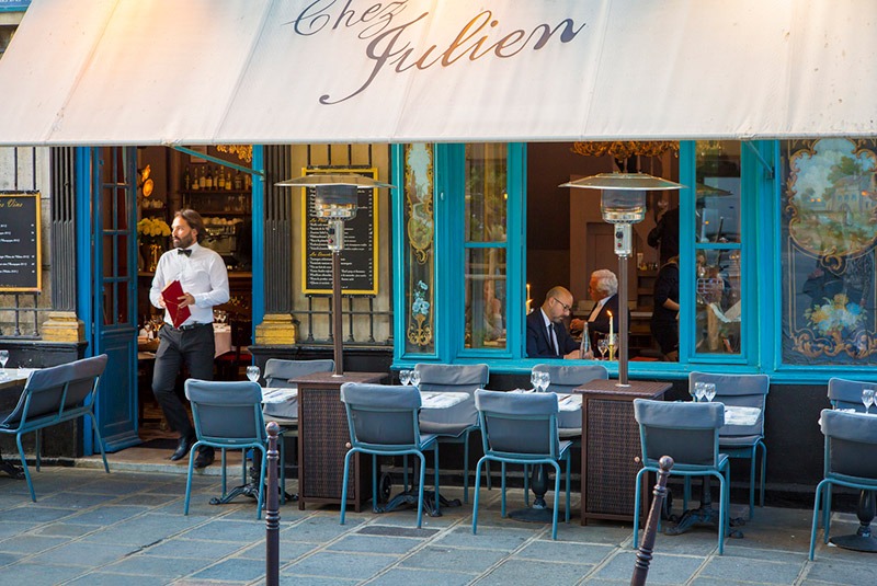 Sidewalk tables at Chez Julien in Paris, France