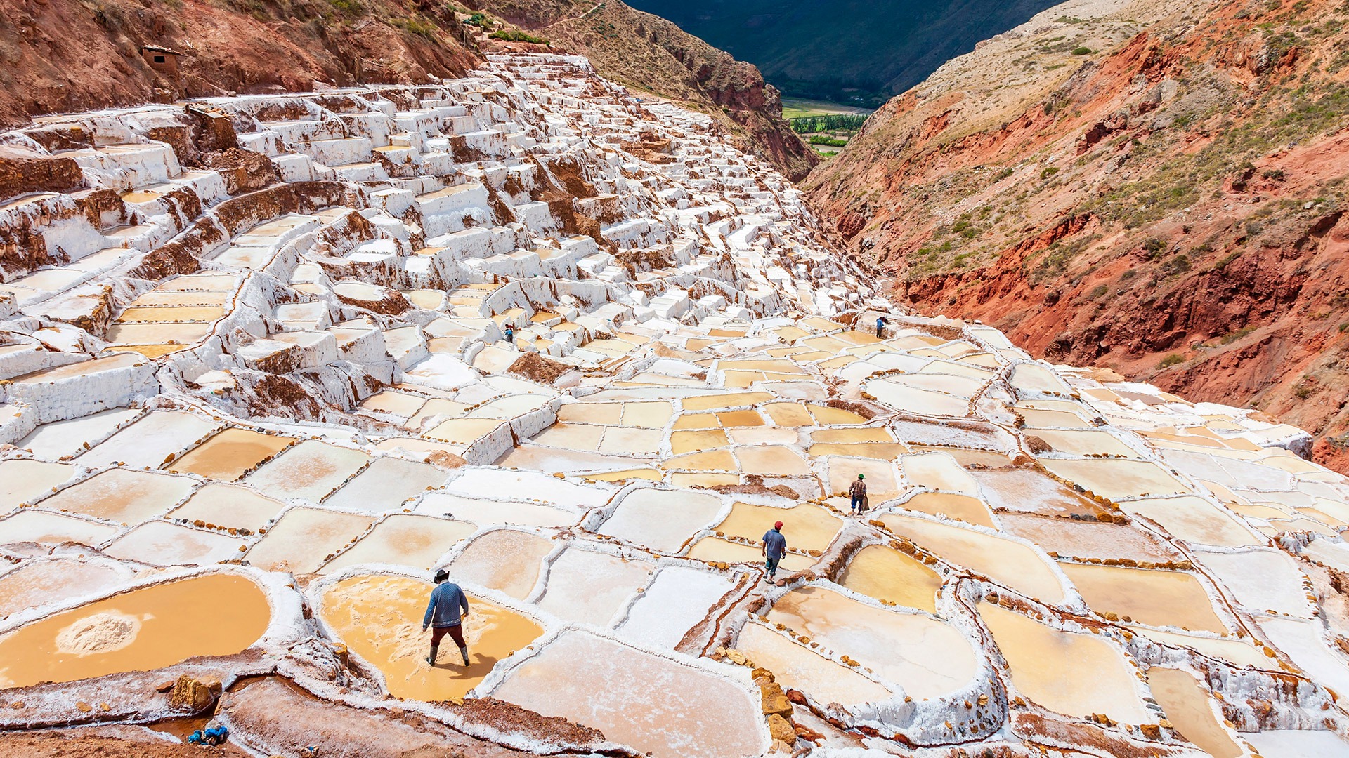 Workers at the salt flats near Maras, Sacred Valley, Peru