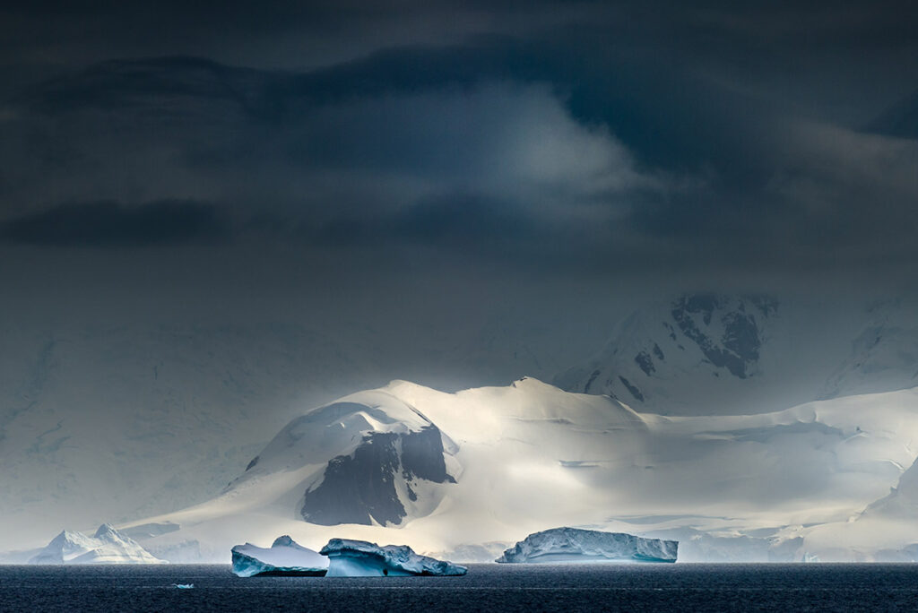 Icebergs and dark skies in Antarctica