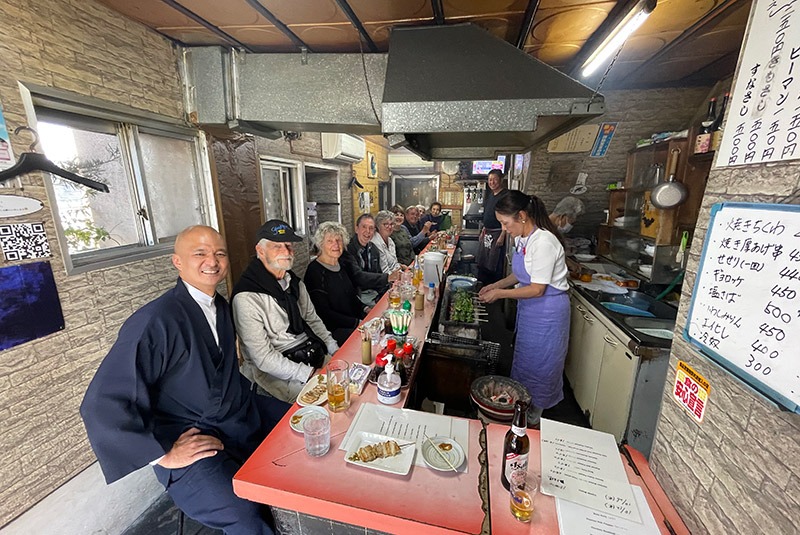 GeoEx group enjoying a yakitori meal in Nagato, Japan